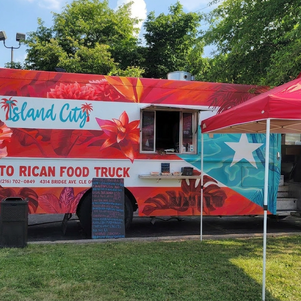 Colorful Island City Puerto Rican food truck parked beneath a red canopy, with floral artwork, service window, and menu board.